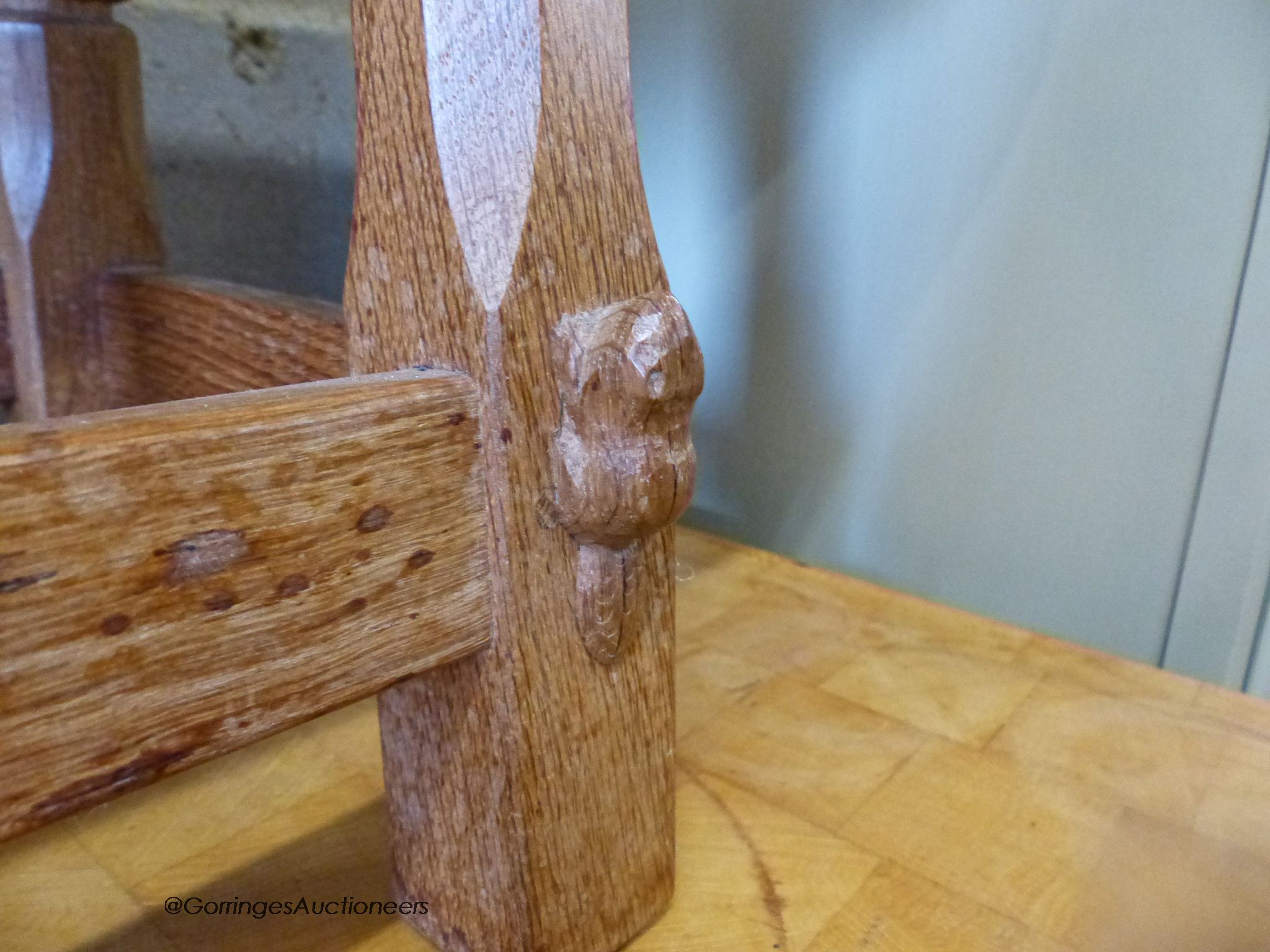 A small 'Beaverman' oak drop leaf occasional table with adzed top, 63cm extended, width 56cm, height 48cm.